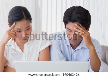 https://thumb9.shutterstock.com/display_pic_with_logo/76219/190463426/stock-photo-worried-couple-using-laptop-together-at-home-in-the-living-room-190463426.jpg