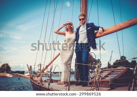 Searching Arrangements Meant for Prisons stock photo stylish wealthy couple on a luxury yacht 299869526