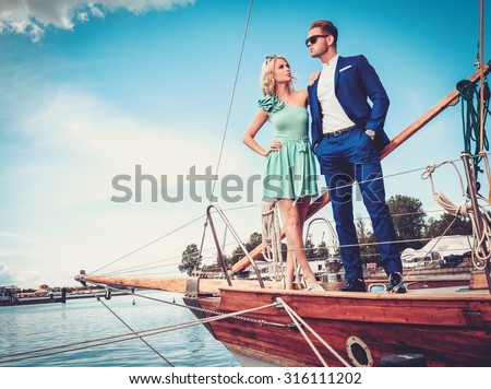 stock photo stylish wealthy couple on a luxury yacht 316111202