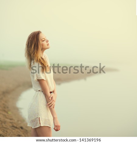 http://thumb9.shutterstock.com/display_pic_with_logo/799939/141369196/stock-photo-beautiful-girl-on-the-beach-alone-141369196.jpg