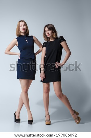 https://thumb9.shutterstock.com/display_pic_with_logo/808756/199086092/stock-photo-two-beautiful-woman-posing-in-a-fancy-dresses-studio-shooting-199086092.jpg