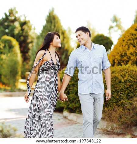 https://thumb9.shutterstock.com/display_pic_with_logo/808816/197343122/stock-photo-happy-young-couple-walking-together-in-a-green-park-197343122.jpg