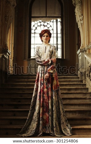 https://thumb9.shutterstock.com/display_pic_with_logo/81677/301254806/stock-photo-beautiful-woman-in-elegant-dress-posing-on-stairs-in-old-vintage-interior-301254806.jpg