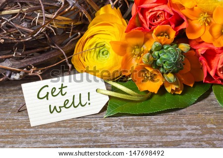 flowers and white card with lettering get well/get well/flowers - stock ...