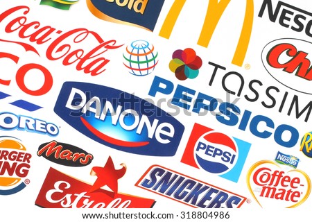 KIEV, UKRAINE - MAY 07, 2015:Collection of popular food logos companies printed on paper:Coca-Cola, Mars, Pepsico, Nestle, Tesco and others