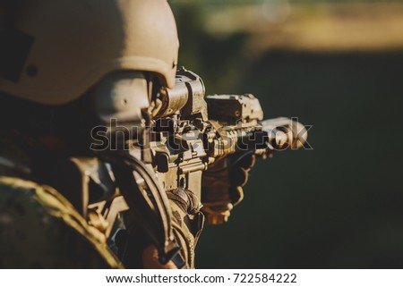 Infantry soldier shooting during military combat training.war, army, weapon, technology and people concept.