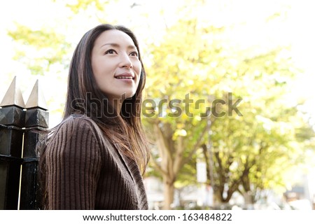 https://thumb9.shutterstock.com/display_pic_with_logo/840583/163484822/stock-photo-portrait-of-an-attractive-japanese-tourist-woman-visiting-the-city-of-london-during-a-sunny-day-and-163484822.jpg