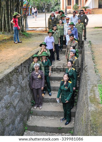 Quang Tri, Vietnam - Apr-15-2011: North Vietnam Army veterans of the Vietnam-American war gather by the steps of Entrance #13 to Vin Moc tunnels to commemorate their wartime sacrifices and struggles.