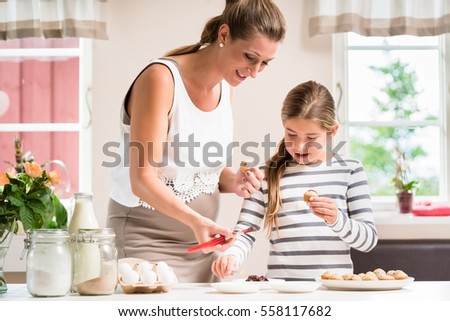 Woman Decorating Cupcakes decorating cupcakes stock photos, royalty-free images & vectors Woman Decorating Cupcakes decorating cupcakes stock photos, royalty-free images & vectors