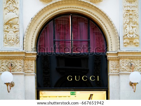 Milan, Italy - October 24, 2016: Gucci Sign on street shop window in Milan.