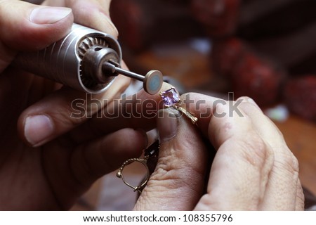 Close up of repairing ring by polishing motors tool