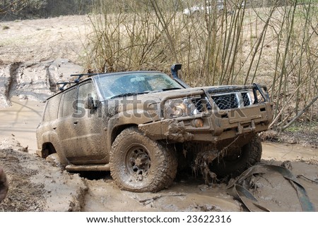 stock-photo-extreme-offroad-car-in-mud-23622316.jpg