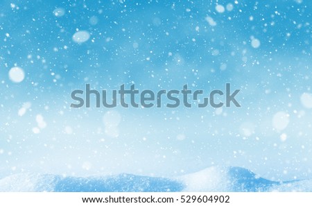 Winter background. Winter bright landscape with snowdrifts and falling snow.