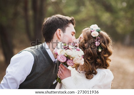 https://thumb9.shutterstock.com/display_pic_with_logo/86802/273011936/stock-photo-happy-bride-and-groom-kissing-in-spring-park-wedding-couple-in-love-wedding-reception-portrait-273011936.jpg