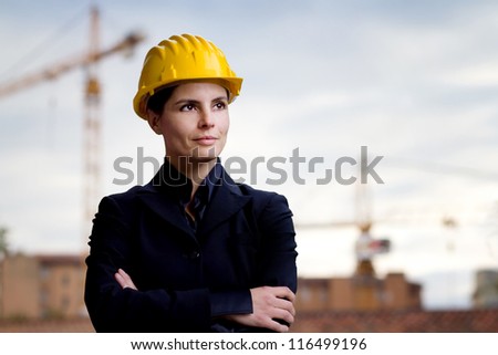 female engineer against building yard