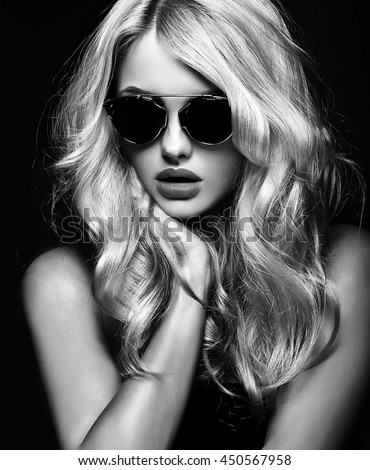 Black and white photo of beautiful cute blonde woman girl in sunglasses Black and white photo of beautiful cute blonde woman girl in sunglasses