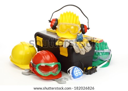 Some color protective helmets and toolbox on white