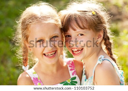 Two girlfriends on a summer day fun laugh