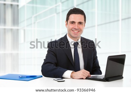 https://thumb9.shutterstock.com/display_pic_with_logo/900050/900050,1327083106,2/stock-photo-handsome-young-business-man-in-blue-suit-in-office-with-laptop-93366946.jpg