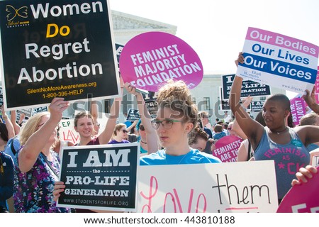 WASHINGTON JUNE 27:  Pro-life and pro-choice activists await the Supreme Courtâ??s ruling on abortion access in front of the Supreme Court in Washington, DC on June 27, 2016