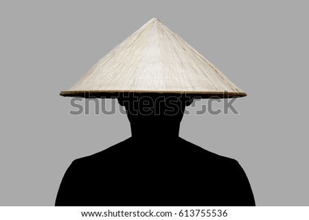 Man with traditional hat from Asia made of wicker