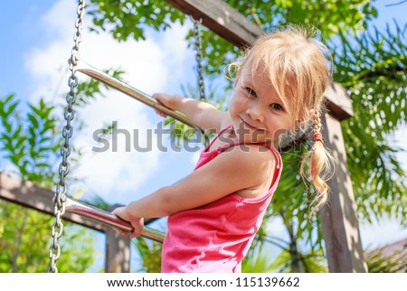 the girl on the playground - stock photo