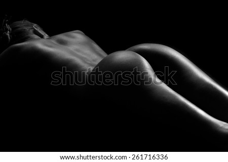 sexy silhouette of a naked female back and buttocks