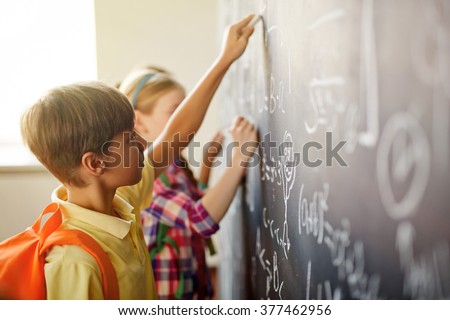 Children by blackboard