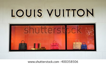 KUALA LUMPUR, MALAYSIA - March 31, 2016. Louis Vuitton product display in glass wall in Kuala Lumpur. Louis Vuitton is a France luxury leather goods company. Founded in Paris, France since 1854.