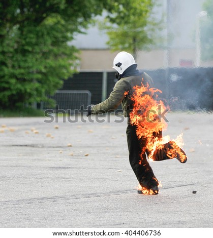 Brabant, the Netherlands - May 13, 2012: running stuntman on fire
