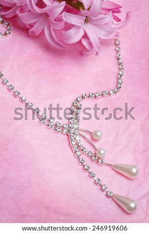 Luxury jewellery pearl over pink background
