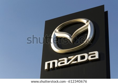 PRAGUE, CZECH REPUBLIC - MARCH 31: Mazda car company logo in front of dealership building on March 31, 2017 in Prague, Czech republic. Mazda set to launch new electric vehicle range by 2019.