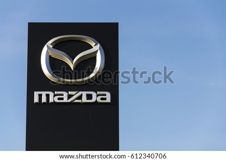 PRAGUE, CZECH REPUBLIC - MARCH 31: Mazda car company logo in front of dealership building on March 31, 2017 in Prague, Czech republic. Mazda set to launch new electric vehicle range by 2019.
