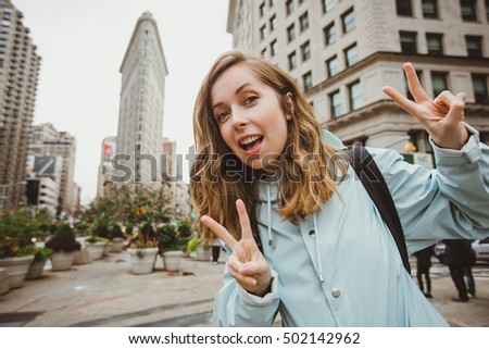 https://thumb9.shutterstock.com/display_pic_with_logo/936964/502142962/stock-photo-happy-young-woman-takes-selfie-photo-near-flat-iron-building-in-manhattan-new-york-attractive-502142962.jpg