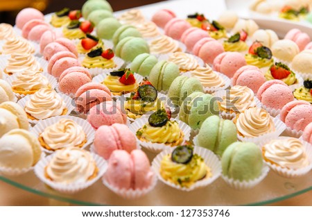 Tray with delicious cakes and macaroon - stock photo