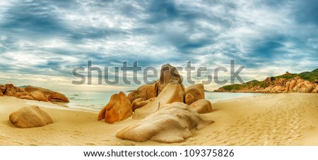 Beautiful beach panorama. Stones on the foreground
