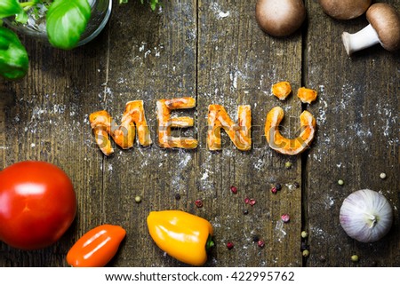 Pizza Dough Letters And Vegetables On Rustic Wooden Table German Word Menue Which Means Pizza Dough Letters And Vegetables On Rustic Wooden Table German Word Menue Which Means