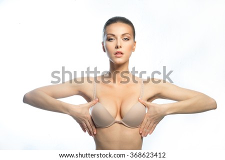 stock-photo-the-girl-of-the-european-appearance-with-a-beautiful-large-breasts-happy-after-plastic-surgery-368623412.jpg