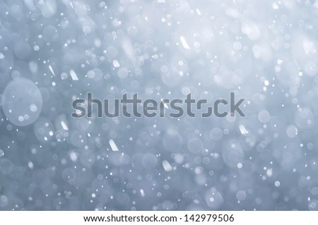 abstract blue bokeh defocused background, falling water drops, rain