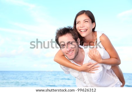 stock photo happy beach couple doing piggyback having summer vacation fun young interracial couple asian 99626312 - Steps to make a Good Impression on Your Online dating services Profile