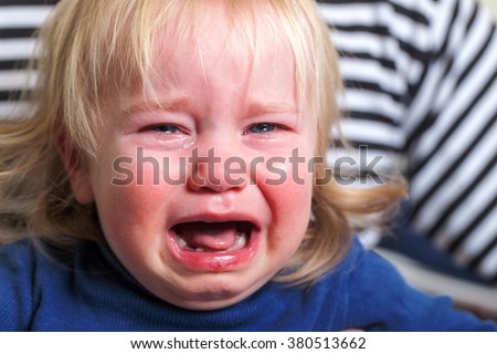crying tears toddler with blond hairstyle