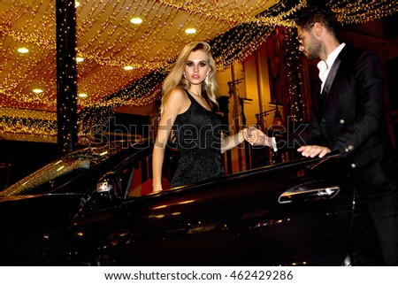 https://thumb9.shutterstock.com/display_pic_with_logo/980267/462429286/stock-photo-meeting-stars-on-the-red-carpet-couple-in-luxury-car-night-life-462429286.jpg