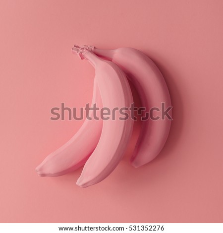Pink bananas on pink background. Minimal style. Flat lay.