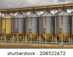 A Row Of Grain Silos Surrounded ...