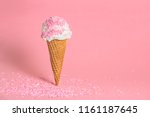 Small photo of funny creative concept of wafer cone with ice cream covered and strewed sprinkles on pink background, copy space