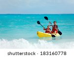 Father And Son Kayaking At...