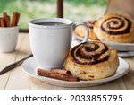 Glazed Cinnamon Roll And Cup Of ...