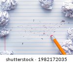 Small photo of School supplies of blank lined notebook paper with eraser marks and erased pencil writing, surrounded by balled up paper and a pencil eraser. Studying or writing mistakes concept.