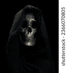 Small photo of Hooded Grim Reaper figure emerging from the shadows. Terrifying human skull, haunted spirt, or frightening ghost rising from dead.