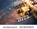 happy new year 2022  background new year holidays card with bright lights,gifts and bottle of сhampagne